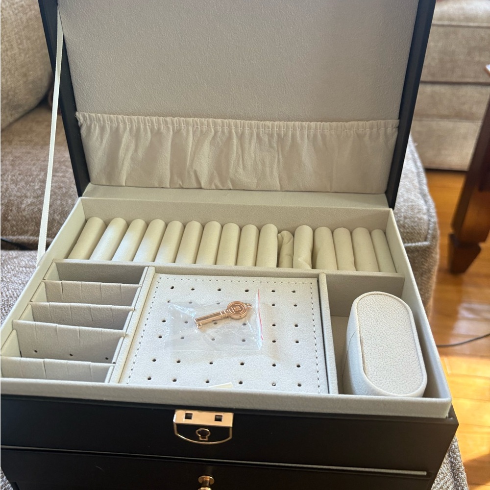 Large jewelry box filled with rings, necklaces, and earrings